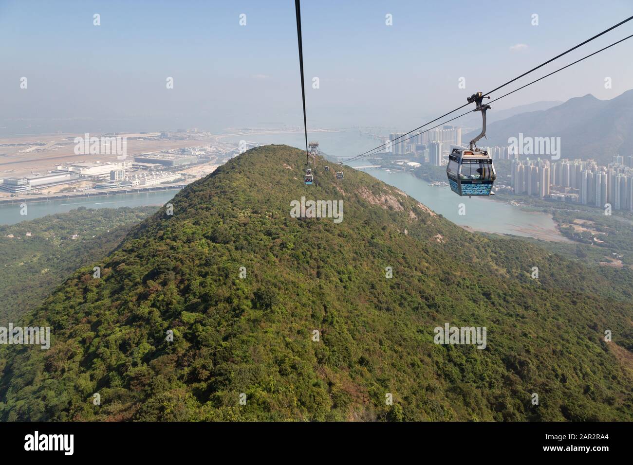 Lantau Island Hong Kong; Cable car, aka Ngong Ping 360, is a 5.7km gondola lift linking Tung Chung with the Po Lin Monastery and the Tian Tan Buddha Stock Photo