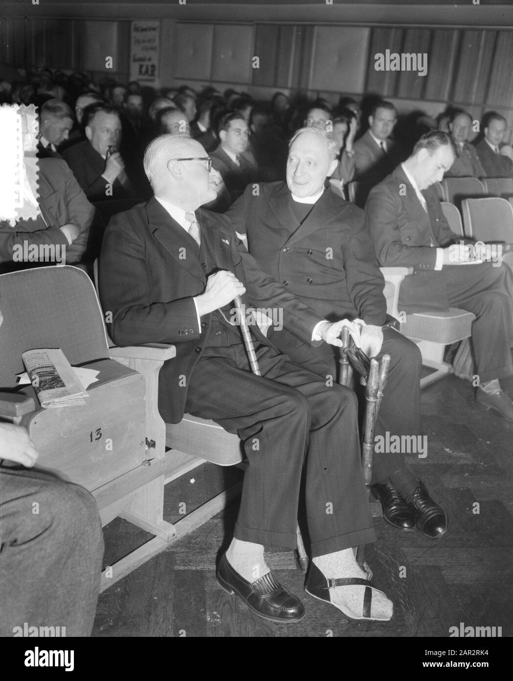 Wages congress of the Catholic Workers Movement (KAB) in Utrecht in building K & W. The chairman of the KVP Group, Prof. mr. C.P.M. Romom with injured foot belonged to the guests. Next to Prof. Romme sits dr. Oilerook Date: 13 October 1953 Location: Utrecht Keywords: congresses, trade unions Personal name: Kab, Romme Stock Photo