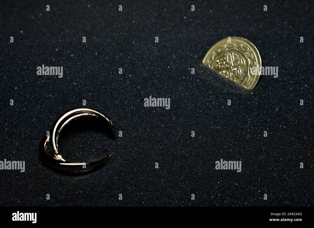 gold things cover into the sand Stock Photo