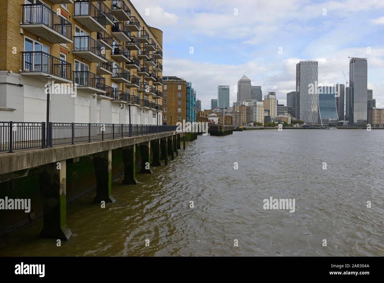 The buildings of Canary Wharf seen down the Thames river from Limehouse basin, London, UK Stock Photo