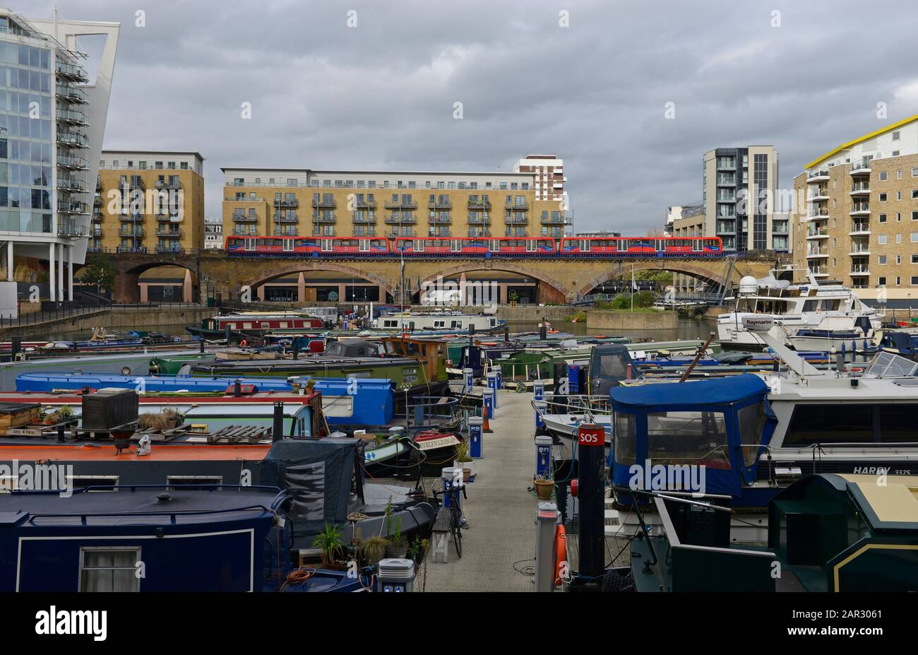 Residential canal boats moored in Limehouse Basin marina in eastern London, London, UK Stock Photo