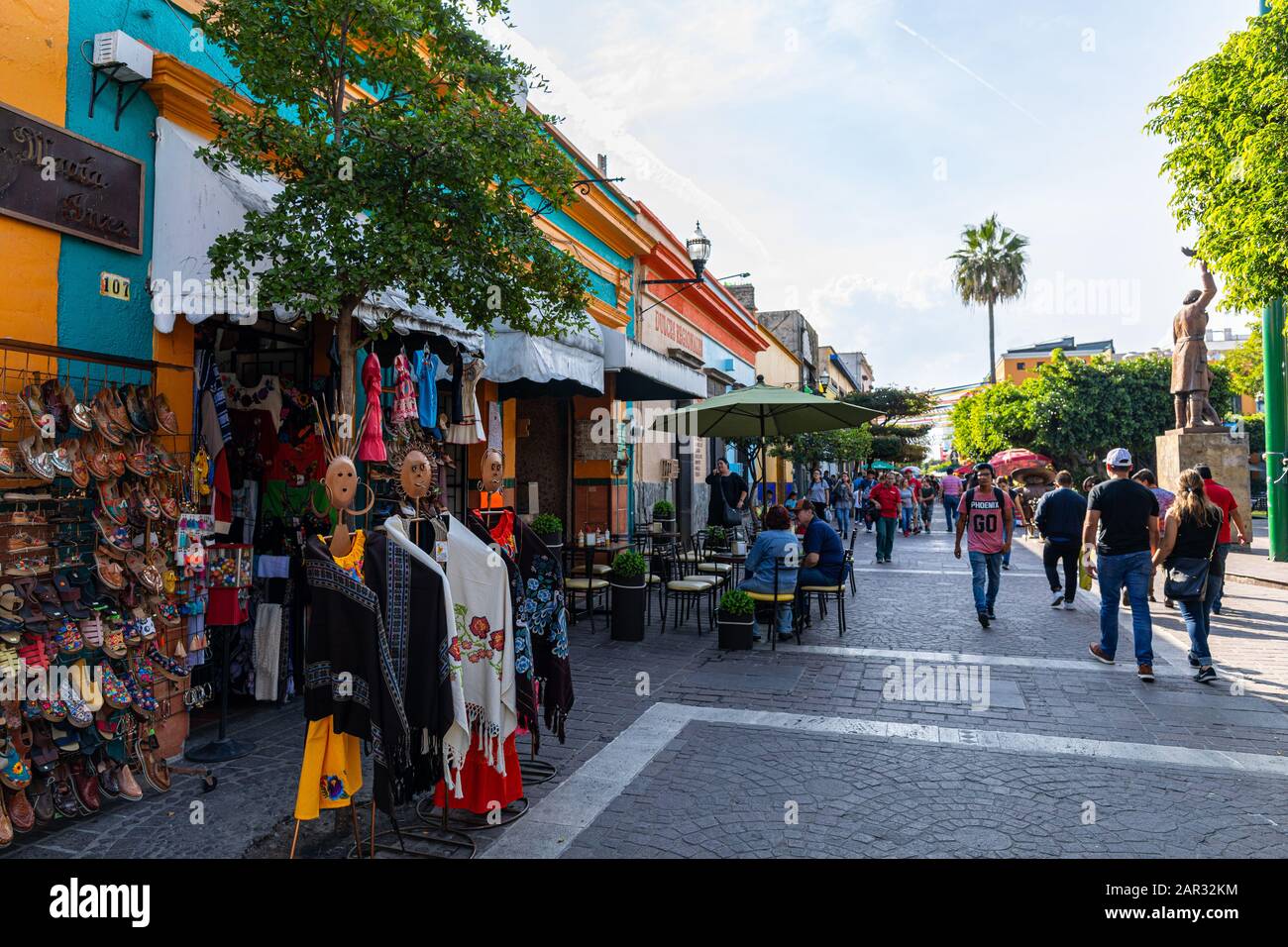 San Pedro Tlaquepaque, Jalisco, Mexico - November 23, 2019: Locals and Tourists exploring the restaurants and shops on Independencia Street Stock Photo