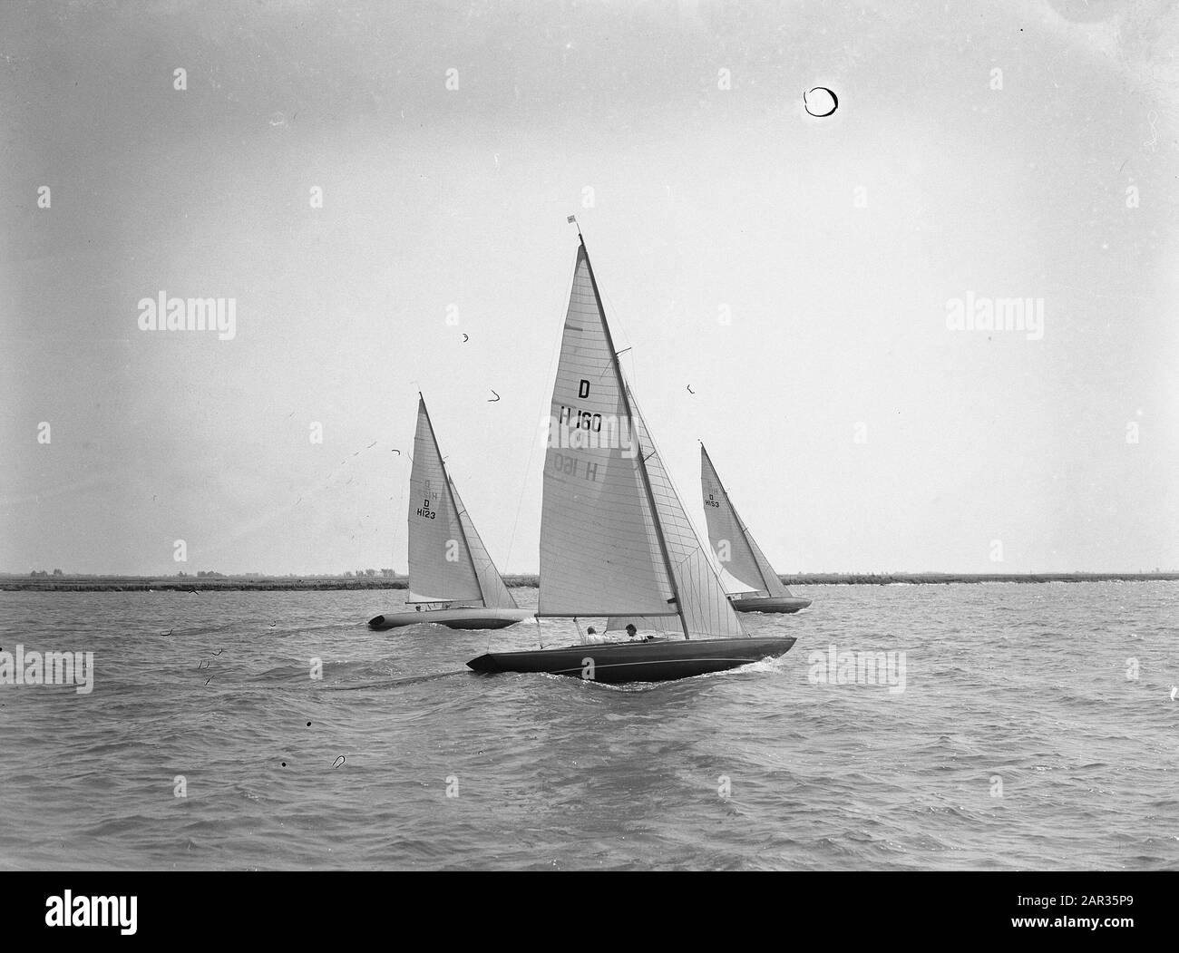 National Sailing competitions Alkmaarsemeer (Dragons) Simon de Wit (H160) and S. Bakker (H123) Date: 23 July 1955 Location: Alkmaardermeer Keywords: sailing Stock Photo