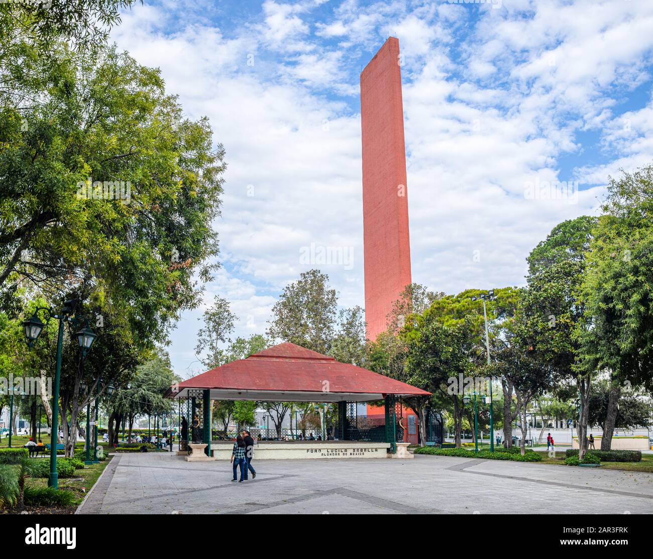 Monterrey, Nuevo Leon, Mexico - November 21, 2019: People walk by the Trade Lighthouse by Luis Barragan  in the Macroplaza Stock Photo