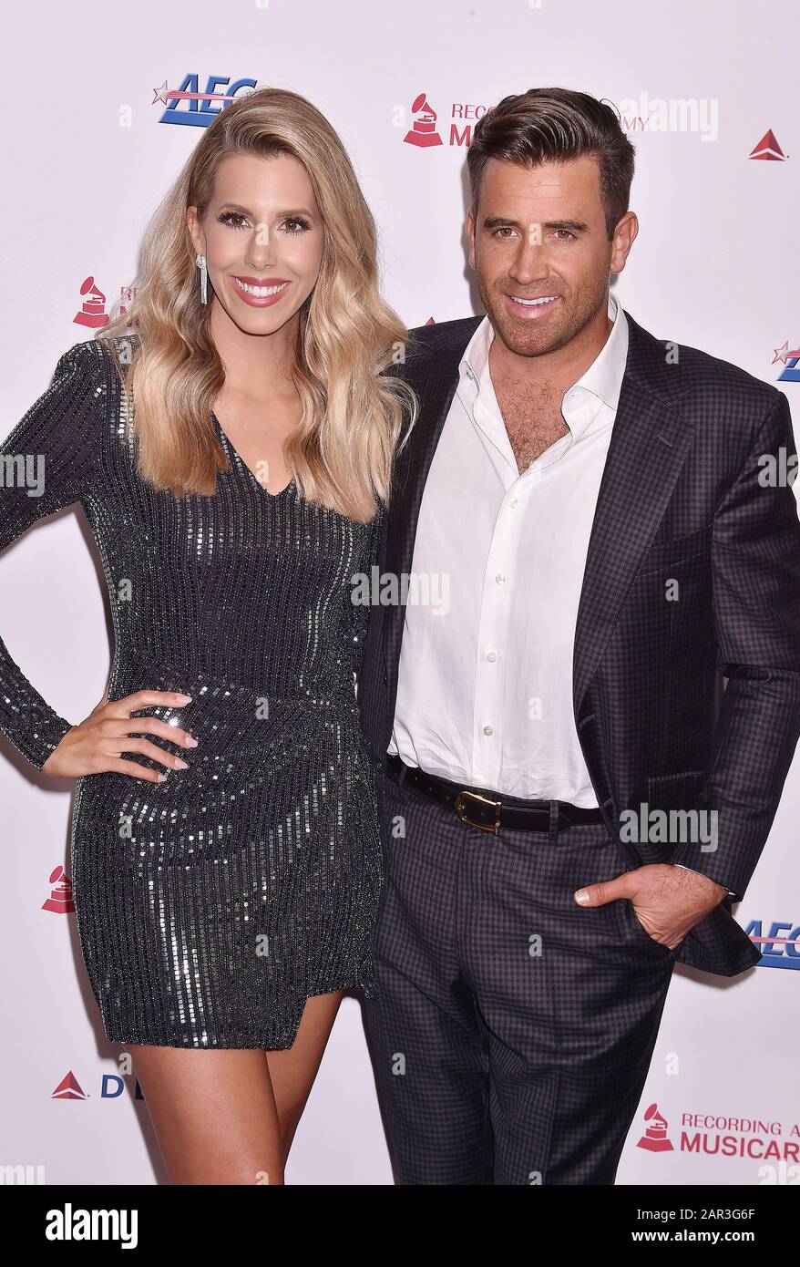 LOS ANGELES, CA - JANUARY 24: Ashley Slack (L) and Jason Wahler attend the 2020 MusiCares Person Of The Year Honoring Aerosmith at West Hall At Los Angeles Convention Center on January 24, 2020 in Los Angeles, California. Stock Photo