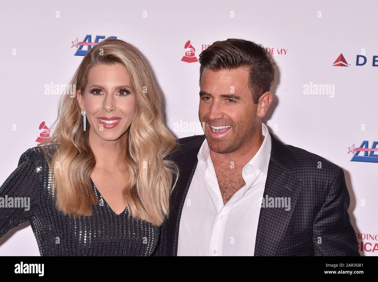 LOS ANGELES, CA - JANUARY 24: Ashley Slack (L) and Jason Wahler attend the 2020 MusiCares Person Of The Year Honoring Aerosmith at West Hall At Los Angeles Convention Center on January 24, 2020 in Los Angeles, California. Stock Photo