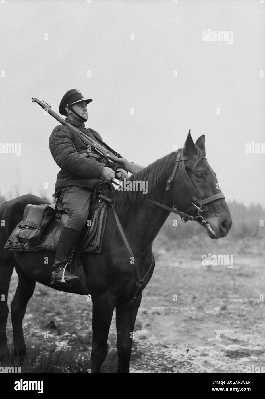 Travel to Poland  Military on horseback with loaded rifle at Stoubcy Annotation: Stoubcy in Belarus is the former Stolpce in Poland Date: 1934 Location: Belarus Keywords: military, horses Stock Photo