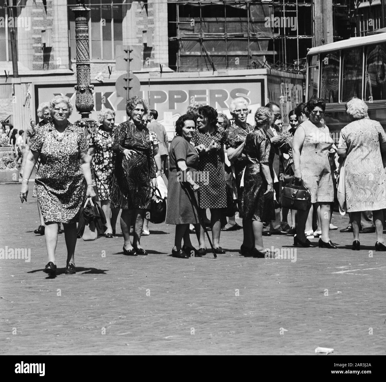 Tourists in Amsterdam, Tourist State Watching Date: 18 June 1973 Location: Amsterdam, Noord-Holland Keywords: Tourists Stock Photo