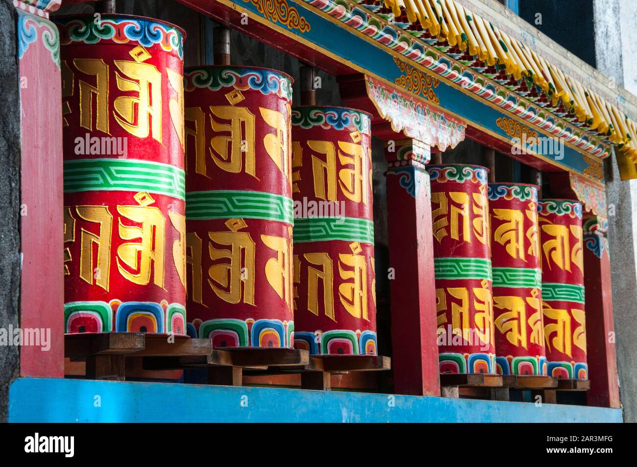 Prayer wheels at Tawang Gompa, an 18th-century Tibetan Buddhist monastery, India's largest, near the Indo-Tibetan border in NE India. Stock Photo
