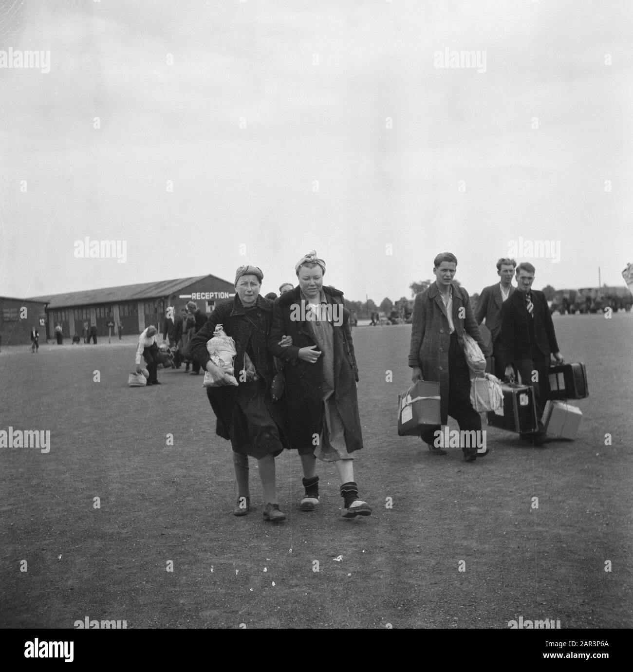 Repatriation Camp Rheine (Germany)  [Repatriants at a gathering place with luggage] Date: 1945 Location: Germany, Rheine Keywords: repatriation, World War II Stock Photo