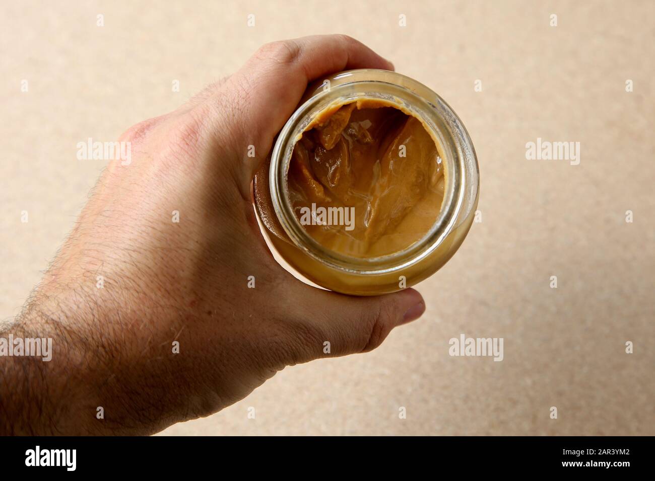 Download A High Angle Shot Of A Person Holding A Jar Of Peanut Butter With A Blurred Background Stock Photo Alamy Yellowimages Mockups