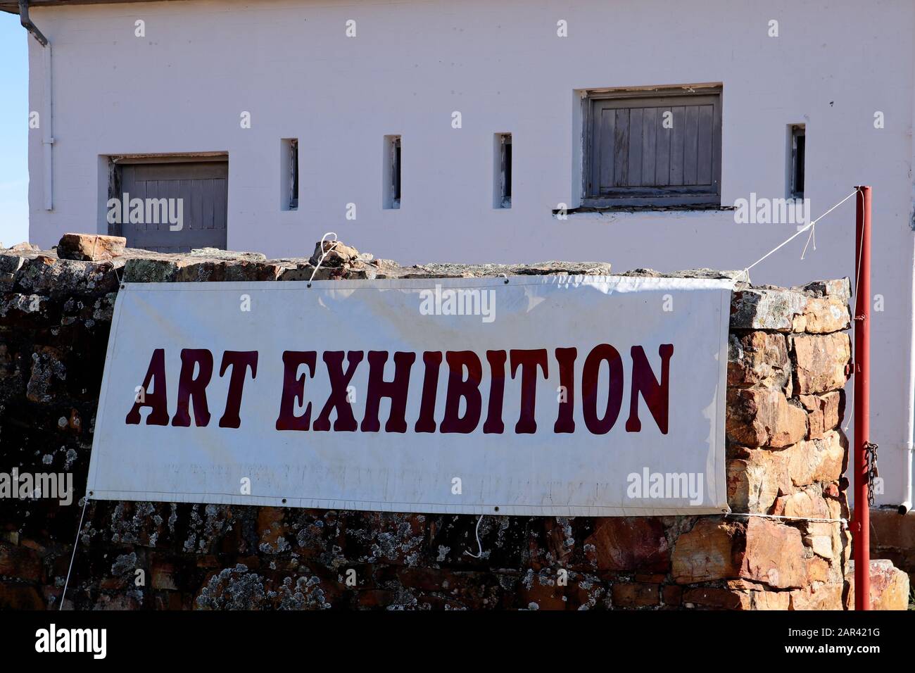 Grahamstown South Africa Jul 31 2019 An Art Exhibition Banner Hanging On A Stone Wall In Makhanda South Africa Stock Photo Alamy