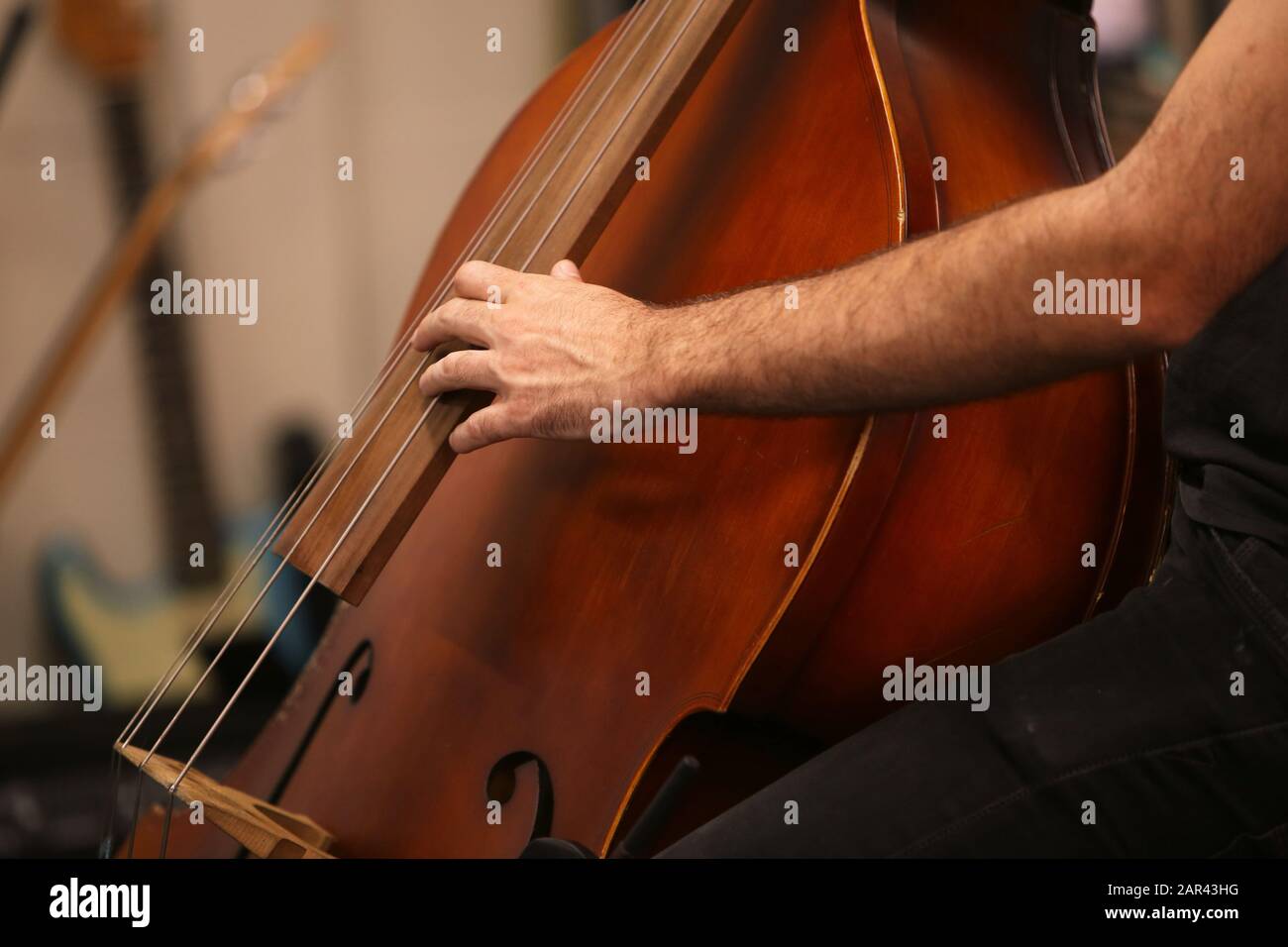 Closeup shot of a person playing the cello Stock Photo