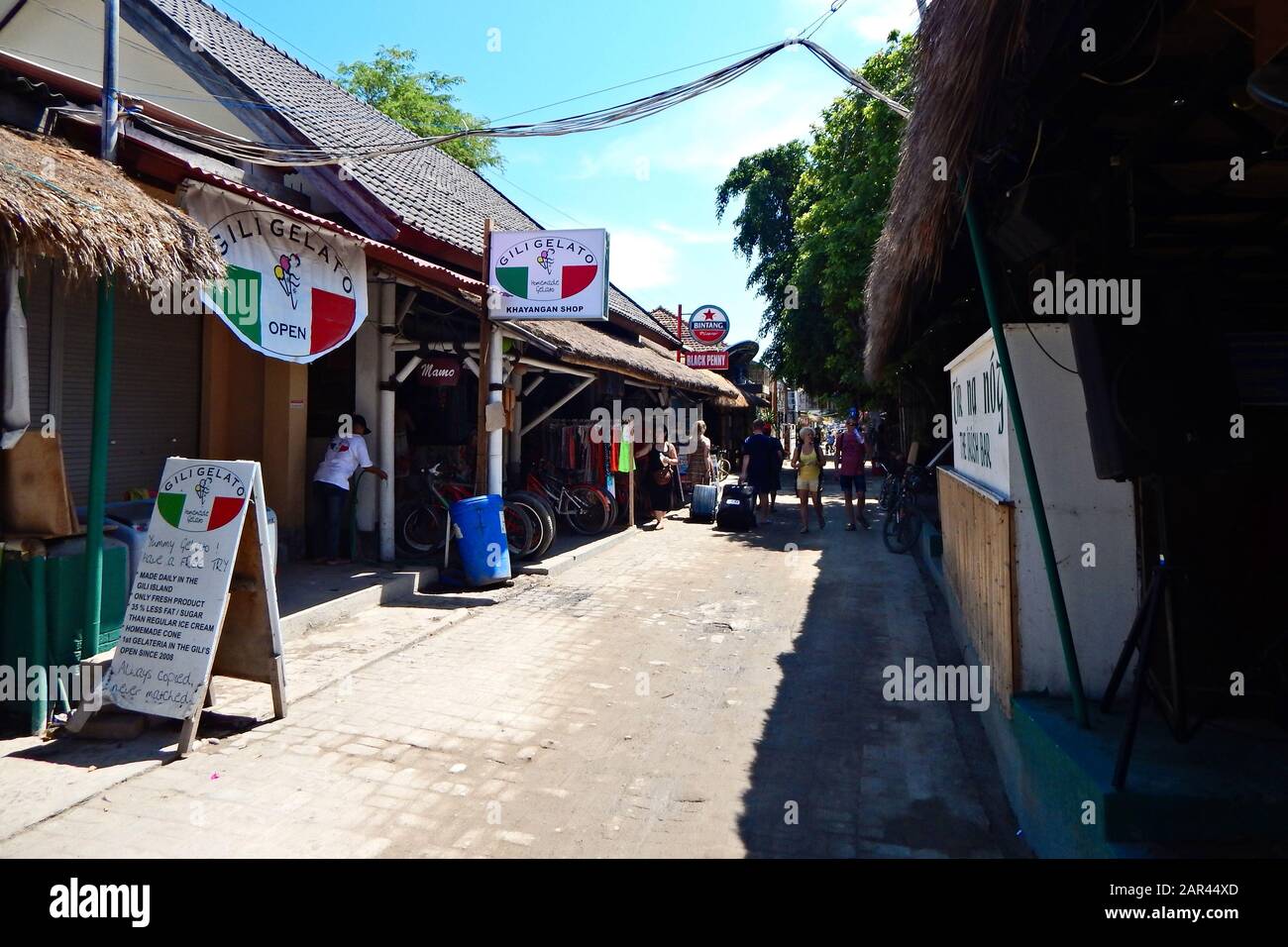 GILI TRAWANGAN, INDONESIA - Jun 05, 2019: The main street in Gili Trawangan, this is a popular tourist area with many shops and beach bars. Stock Photo