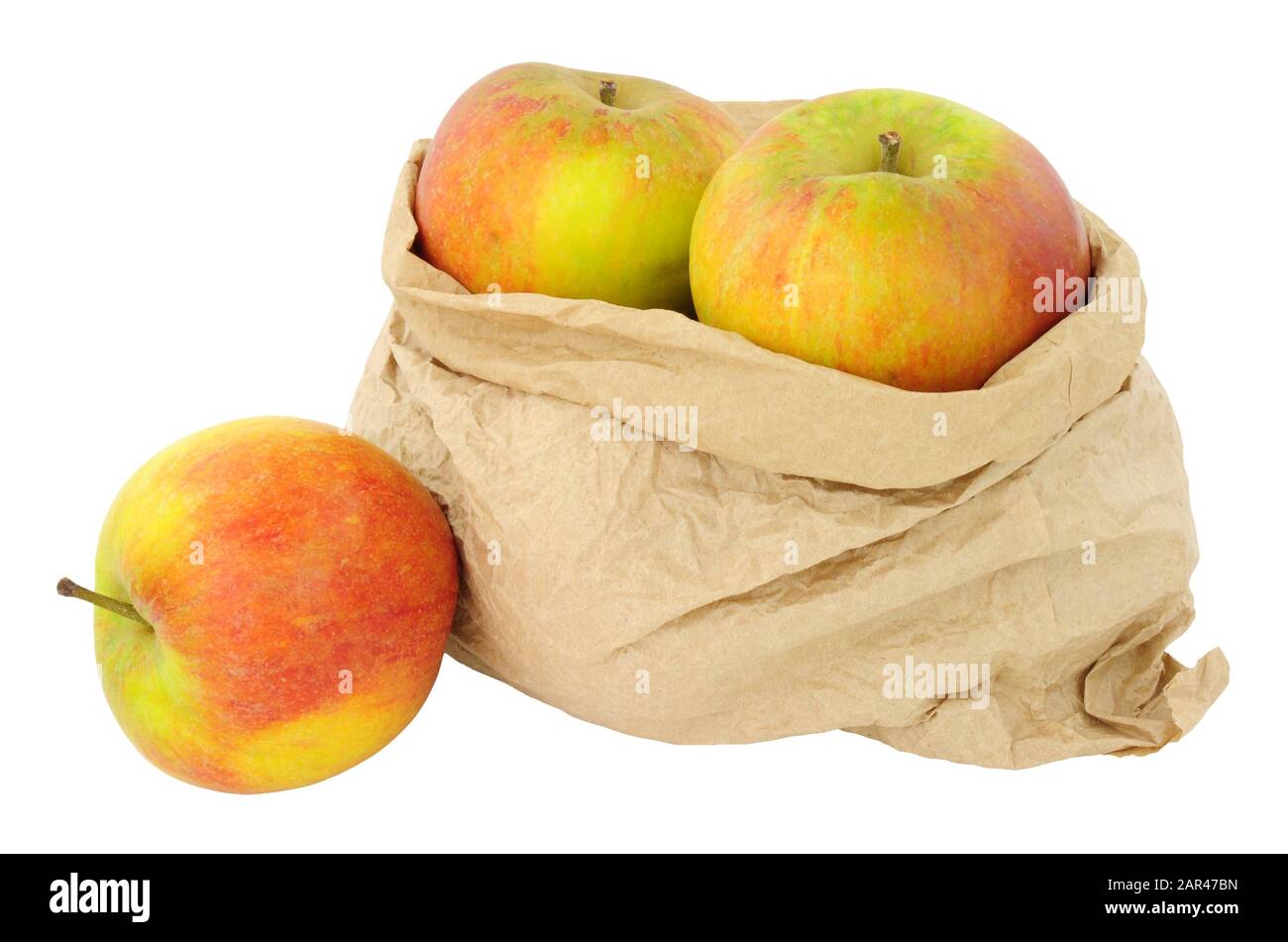 Fresh apples in an environmentally friendly brown paper bag isolated on a white background Stock Photo