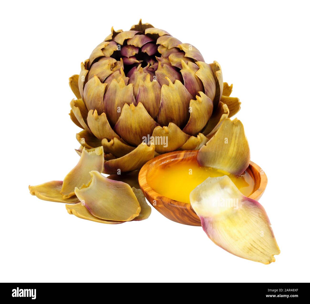 Steamed green globe artichoke flower bud with bowl of melted butter