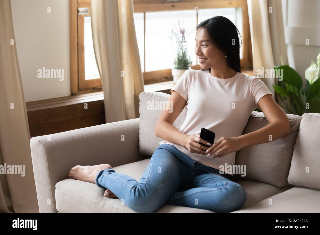 Dreamy Vietnamese girl look in distance visualizing Stock Photo - Alamy