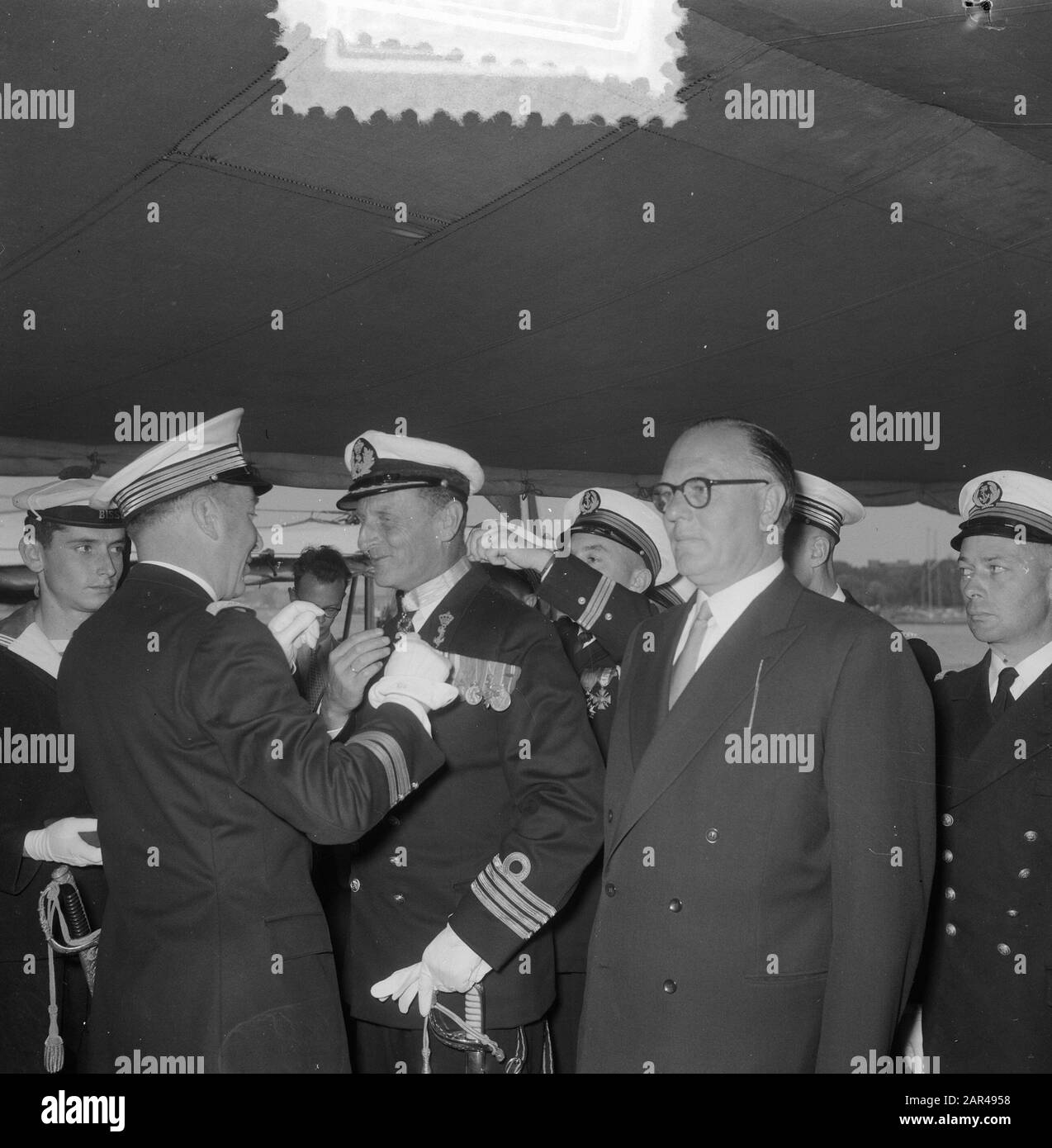 Awards awards on board French warship Brisson captain at sea J. S. Bax and Lieutenant at sea W. van der Tol Date: 14 August 1953 Keywords: Awards, Awards Personal name: captein ter zee J.S. Bax, zee W. van der Tol Stock Photo