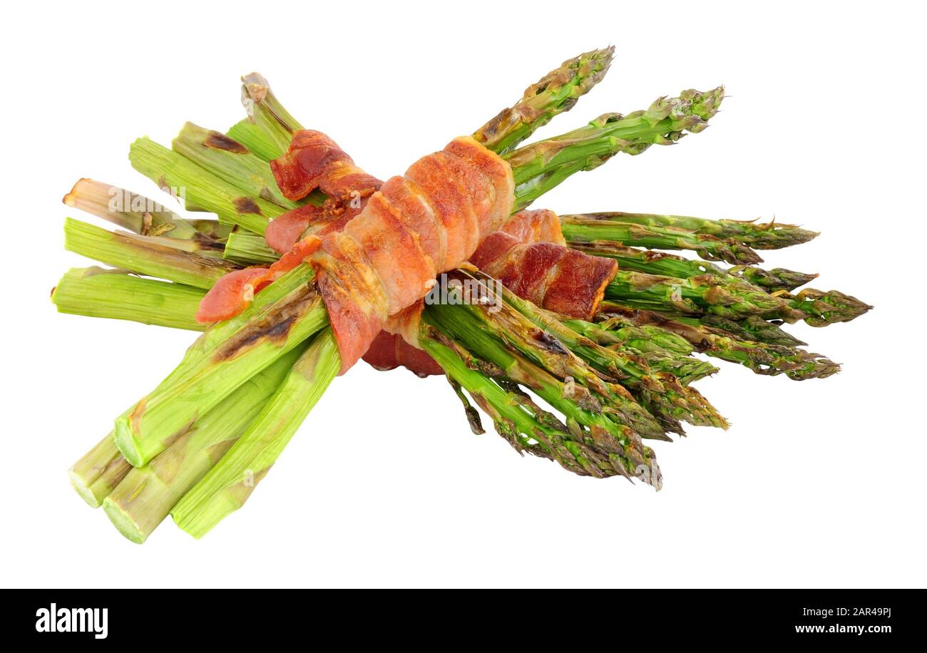 Grilled asparagus wrapped in smoked streaky bacon rashers isolated on a white background Stock Photo