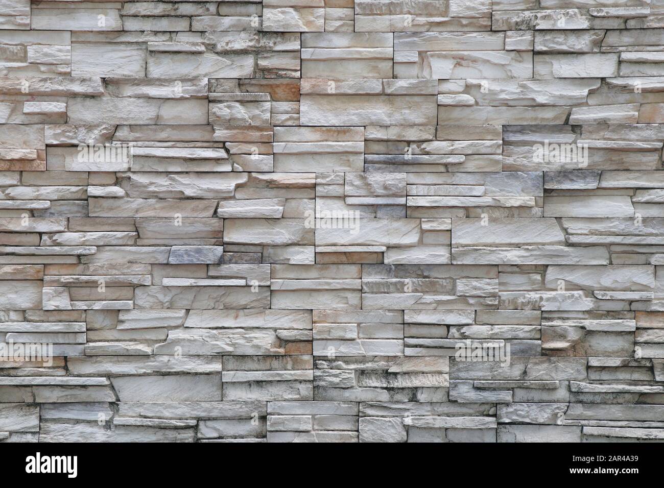 Stone background walls are stacked. Stone cladding background and wallpaper  Stock Photo - Alamy