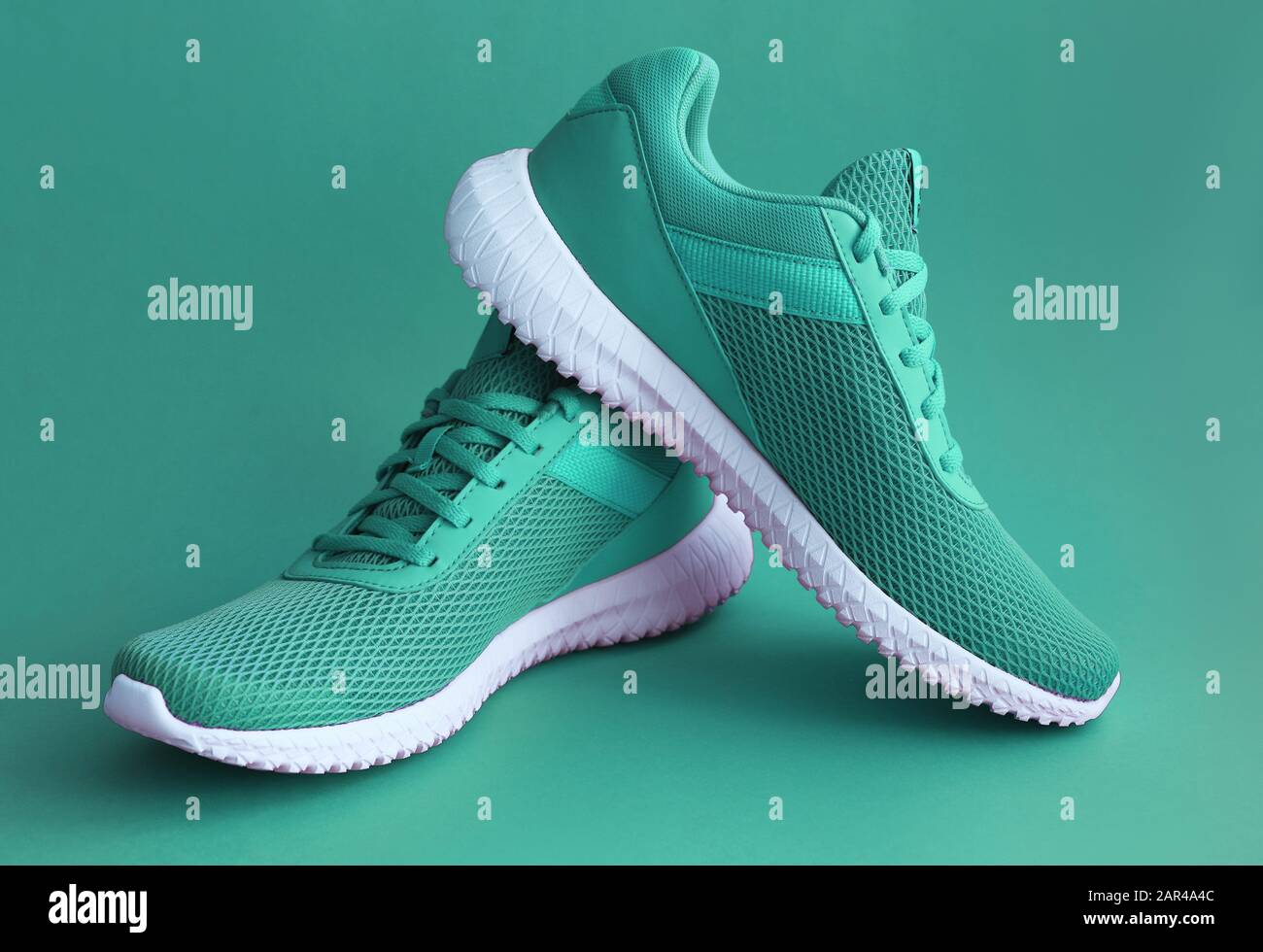 Colorful sport shoes on green color 