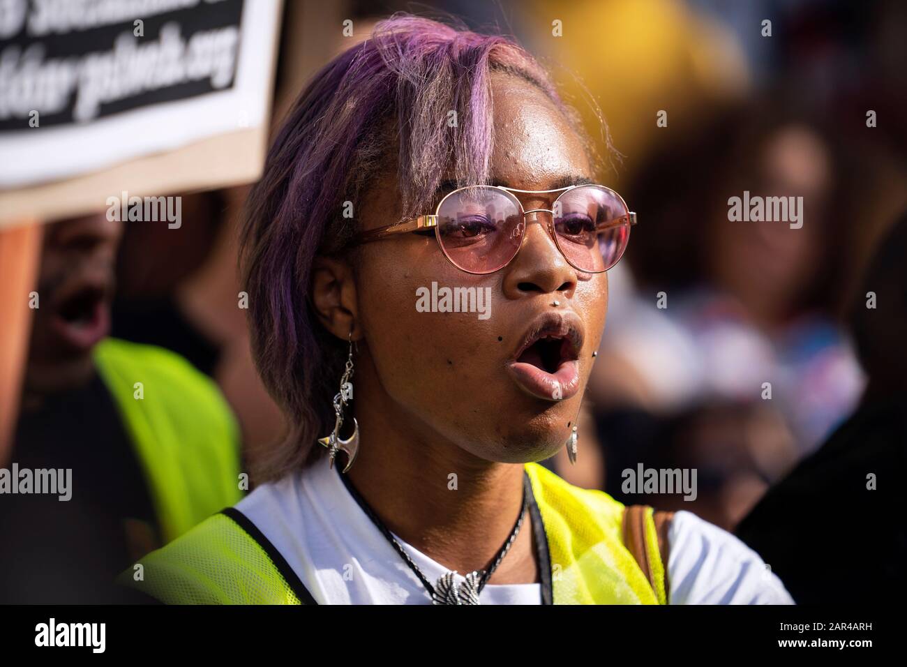 A protester chants slogans during the demonstration.No War in Iran protest against the Trump Administration’s military actions and economic sanctions against Iran. Organizers called on Trump to withdraw U.S. troops from Iraq and not to drag the U.S. into a war in the Middle East. Stock Photo