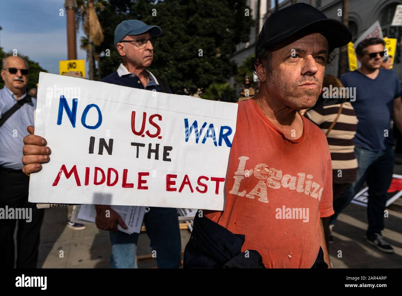 A protester holds a placard during the demonstration.No War in Iran protest against the Trump Administration’s military actions and economic sanctions against Iran. Organizers called on Trump to withdraw U.S. troops from Iraq and not to drag the U.S. into a war in the Middle East. Stock Photo