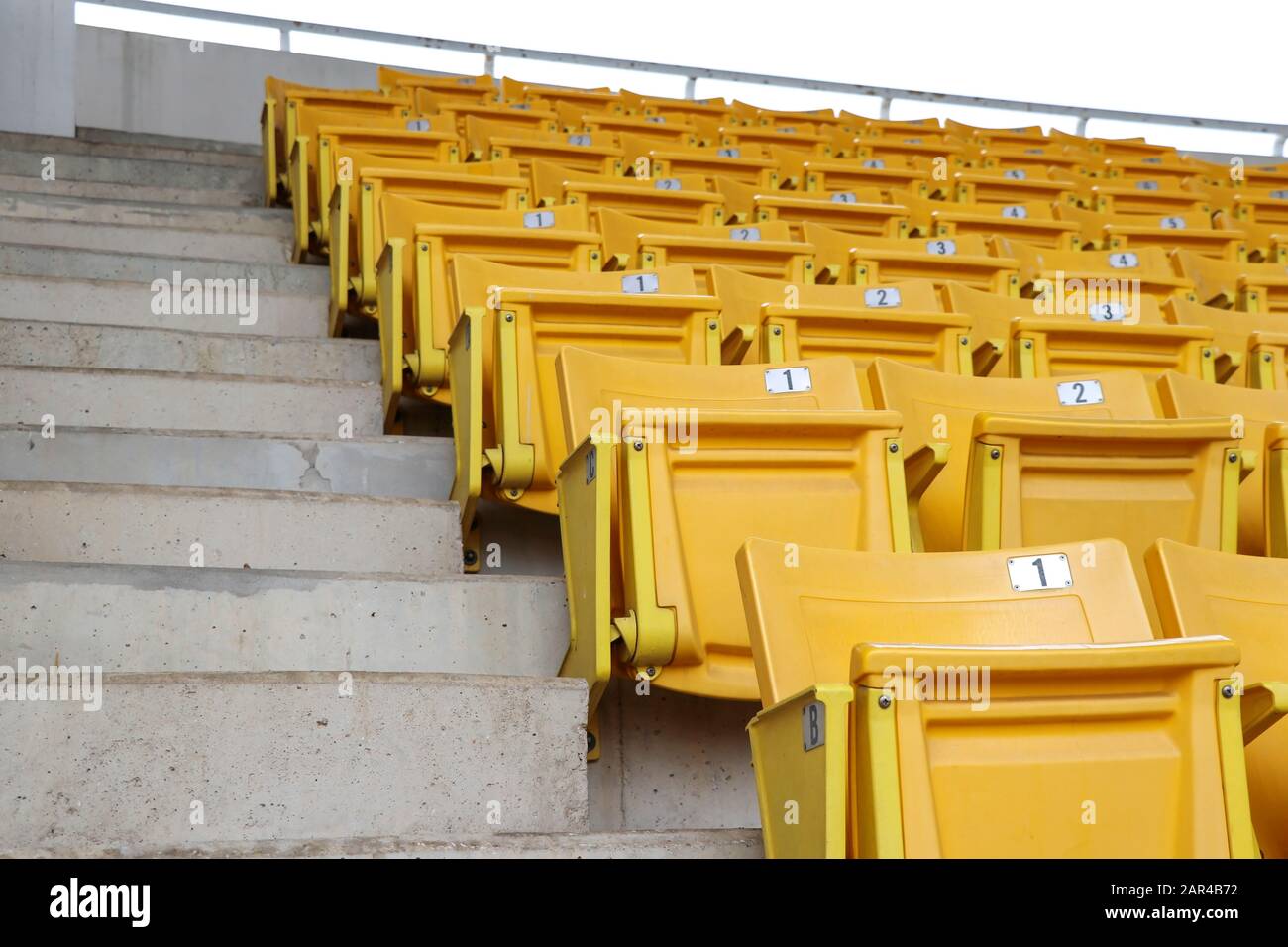 A chair for watching sports on the amphitheater. Chairs lined up in the