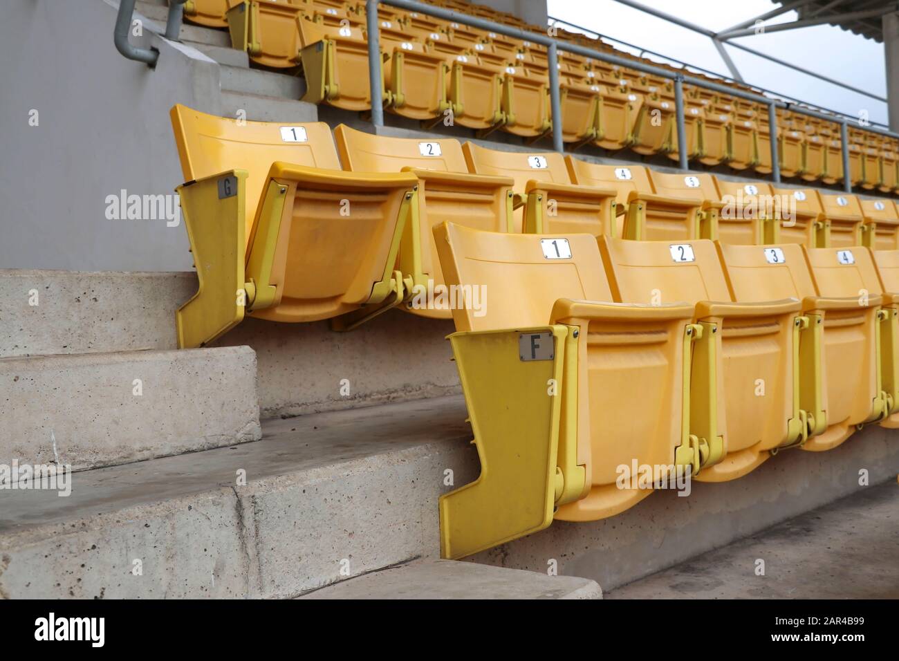 A chair for watching sports on the amphitheater. Chairs lined up in the