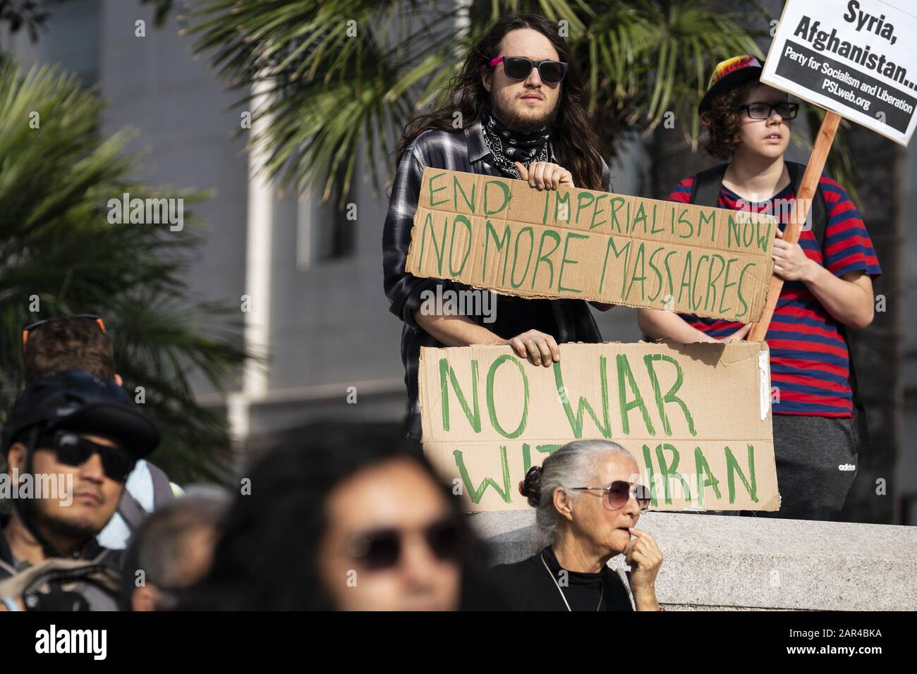 Los Angeles, USA. 15th Mar, 2019. Protesters hold placards during the demonstration.No War in Iran protest against the Trump Administration's military actions and economic sanctions against Iran. Organizers called on Trump to withdraw U.S. troops from Iraq and not to drag the U.S. into a war in the Middle East. Credit: Ronen Tivony/SOPA Images/ZUMA Wire/Alamy Live News Stock Photo