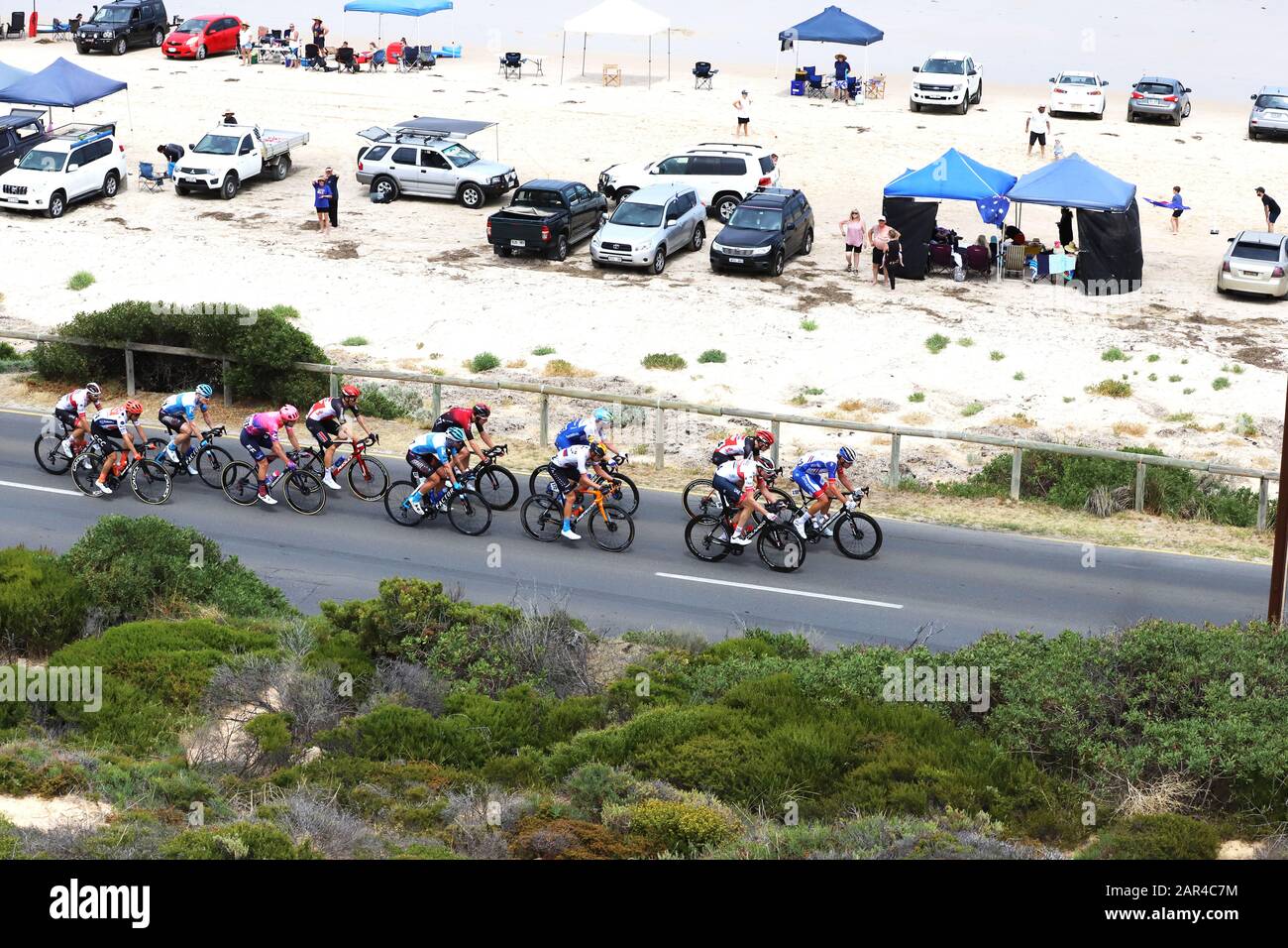 Aldinga, Adelaide, Australia. 26 January 2020. Riders competing on stage 6 of the Tour Down Under cycling race as it passes through the beachfront area of Aldinga. The stage winner was British rider Matthew Holmes of the Lotto Soudal team. He is the third rider in the shot. Credit: Russell Mountford/Alamy Live News. Stock Photo
