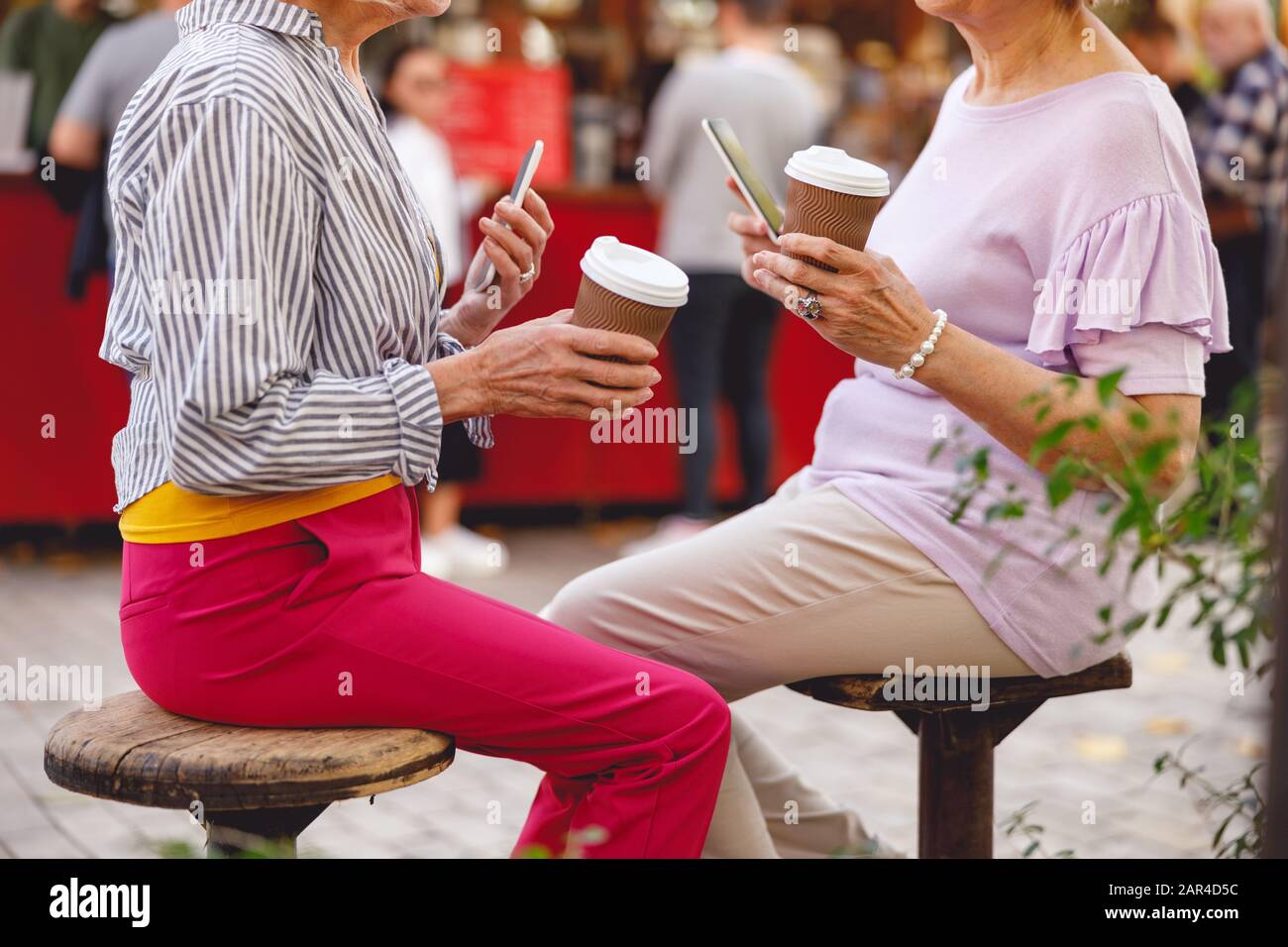 Two friends having their morning coffee outside Stock Photo Alamy