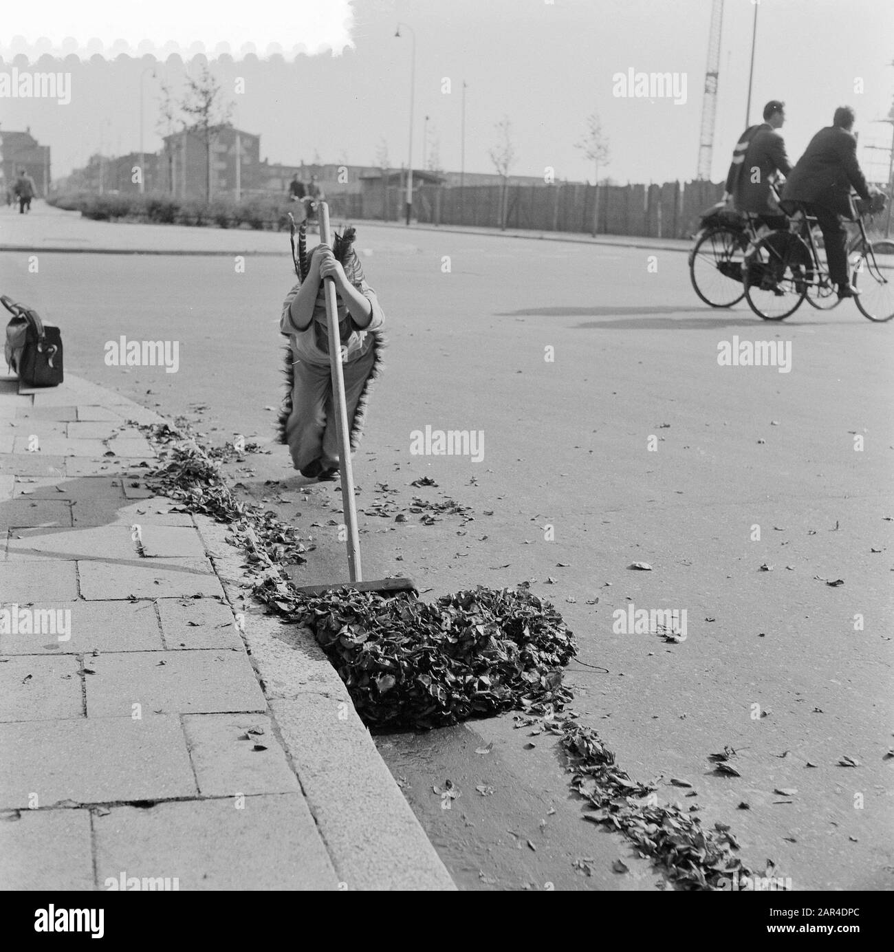 Boy wiping leaves Date: September 26, 1957 Keywords: BROWS Stock Photo