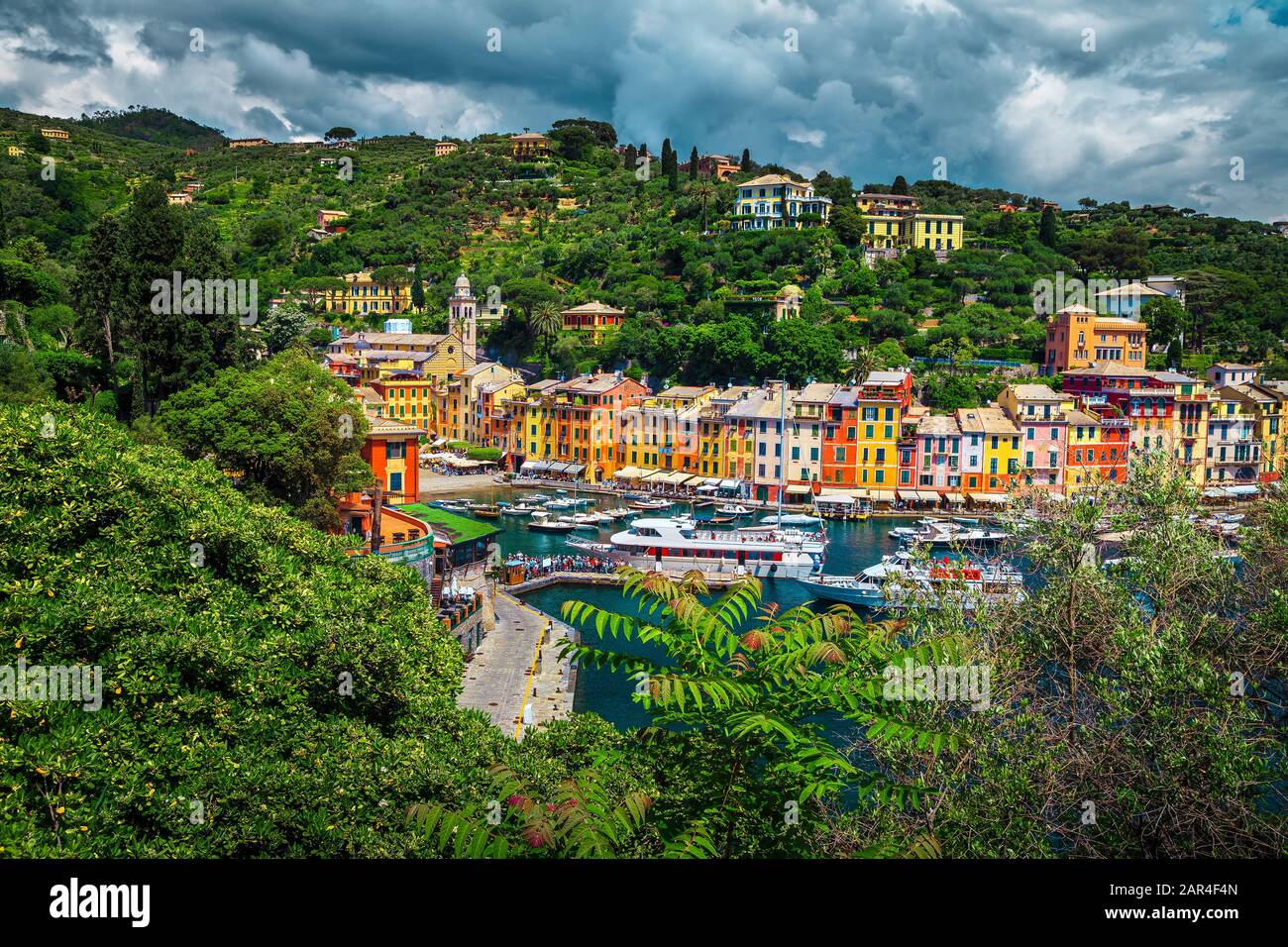 Popular travel location, Portofino old fishing village, admirable colorful mediterranean buildings and luxury harbor with boats, yachts, Liguria, Ital Stock Photo