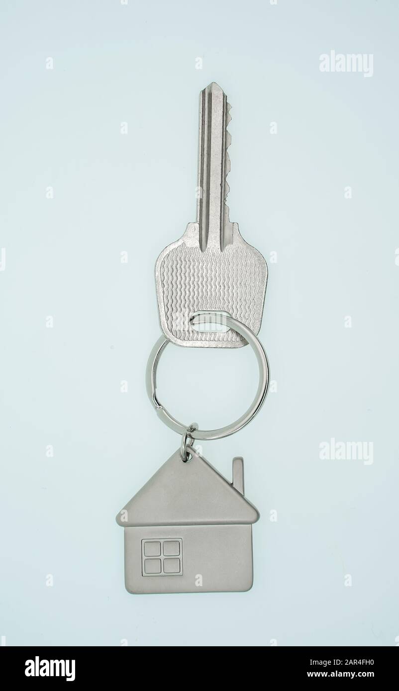 key chain with house symbol and keys on white background,Real estate ...