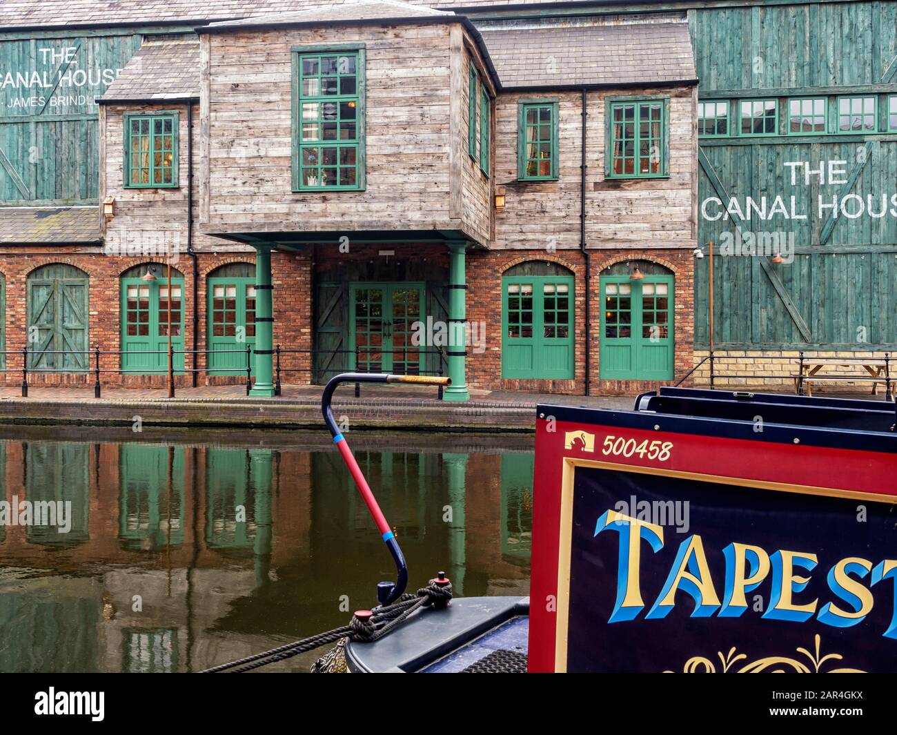 BIRMINGHAM, UK - MAY 28, 2019:  View ofThe Canal House Bar Restaurant  over narrowboat moored on the canal at Brindley Place. Stock Photo