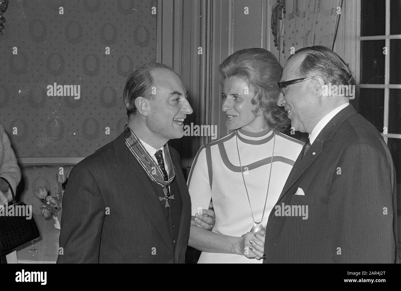 Drs. W. K. N. Schmelzer receives Cross of Merit from West German Embassy for help from the Netherlands to Germany after the war, in Embassy West Germany,/Date: 4 February 1971 Location: Germany Keywords: embassies, receipts, wars Personal name: drs. W. K. N. Schmelzer Stock Photo