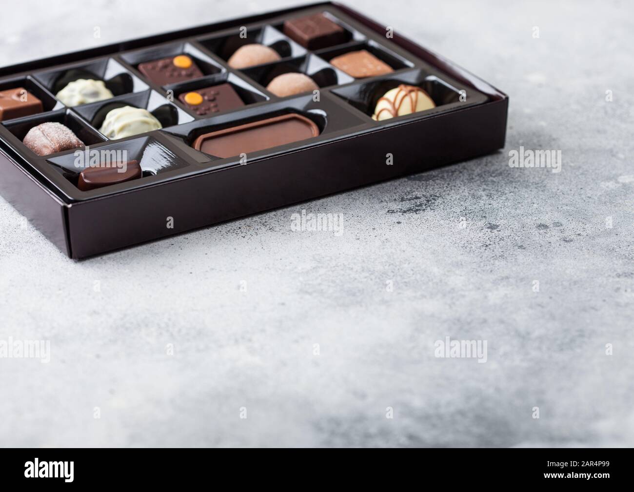 Box Of Luxury Chocolate Candies Selection On Light Background
