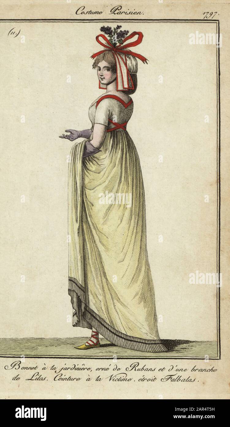 Woman in victim-style belt and jardiniere hat, 1797. Gardener-style bonnet  decorated with ribbons and lilac. Belt crossed over the back, victim-style.  Dress with narrow frill at the bottom. Bonnet a la jardiniere
