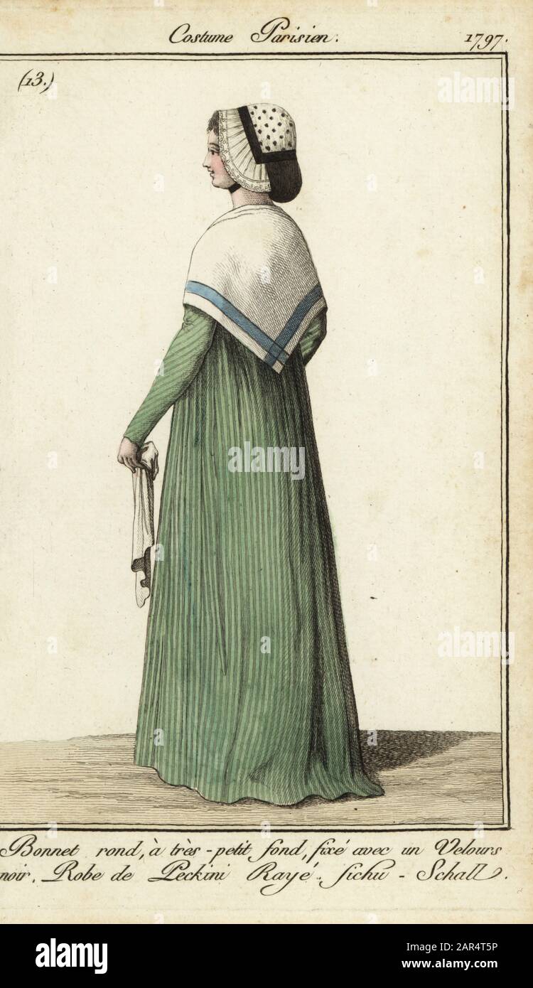 Woman in striped dress with kerchief shawl, 1797. She wears a round bonnet with a small crown, fixed with black velvet. Dress in striped silk or Pekin and kerchief-shawl. Bonnet rond a tres-petit fond, fixe avec un velours noir. Robe de Peckini raye, fichu-schall. Handcoloured copperplate engraving from Pierre de la Mesangere’s Journal des Modes et Dames, Paris, 1797. The illustrations in volume 1 were by Carle Vernet, Claude Louis Desrais and Philibert Louis Debucourt. Stock Photo