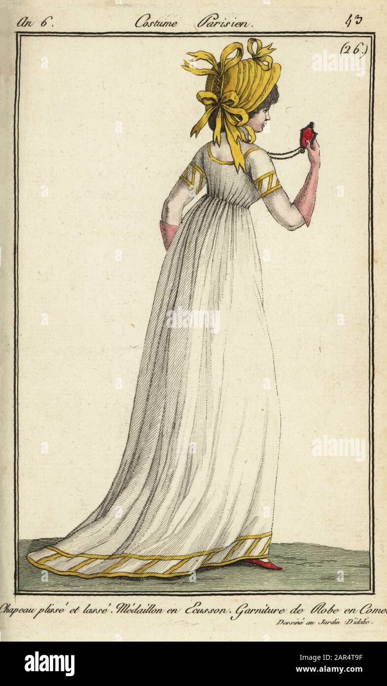 Woman dressed for the Jardin d'Idalie pleasure gardens, 1798. Her long  dress is decorated with comete ribbon. Her hat has pleats and bows and she  holds a medallion with an insignia. The