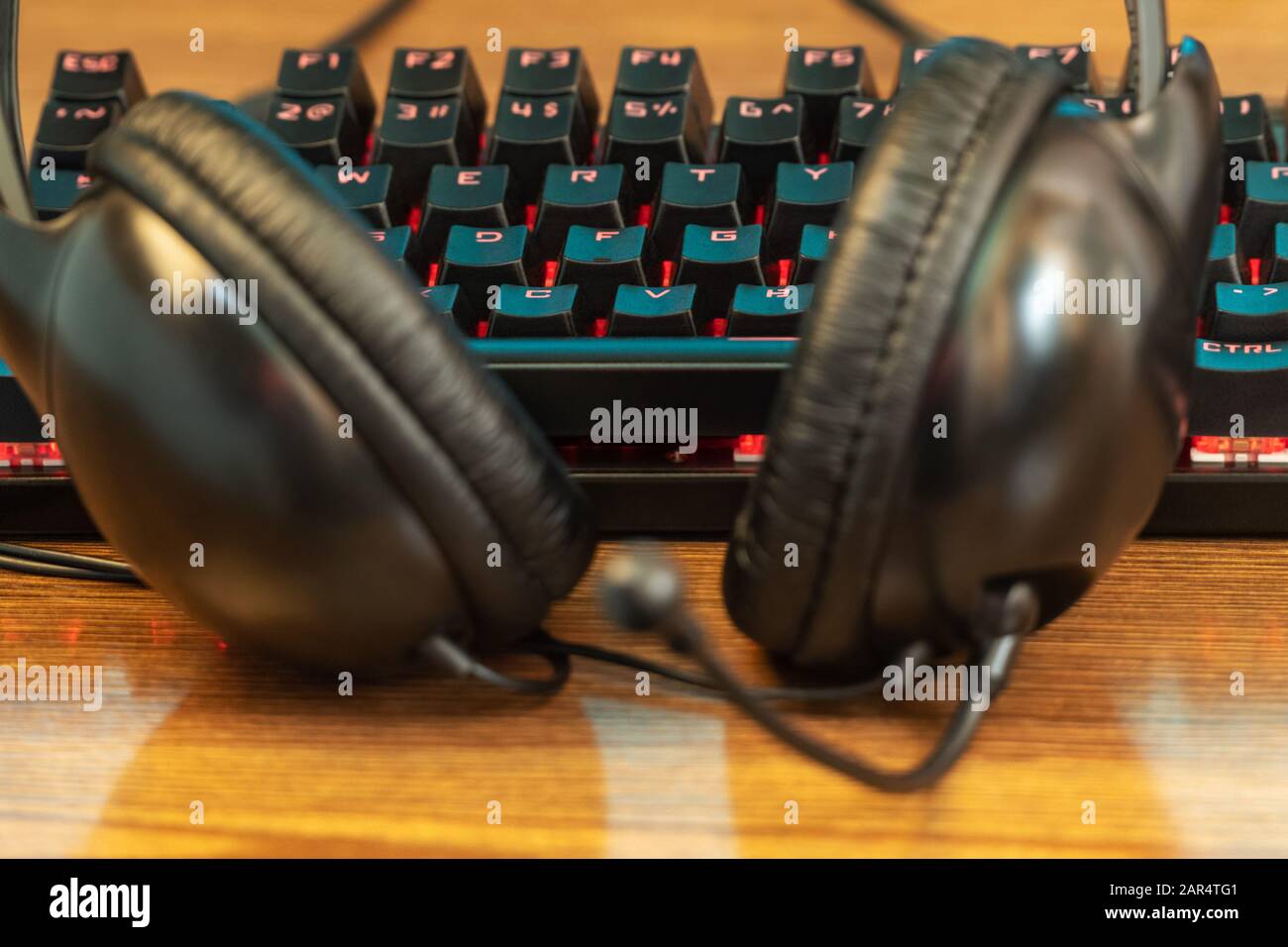 headphones lying at the keyboard Stock Photo