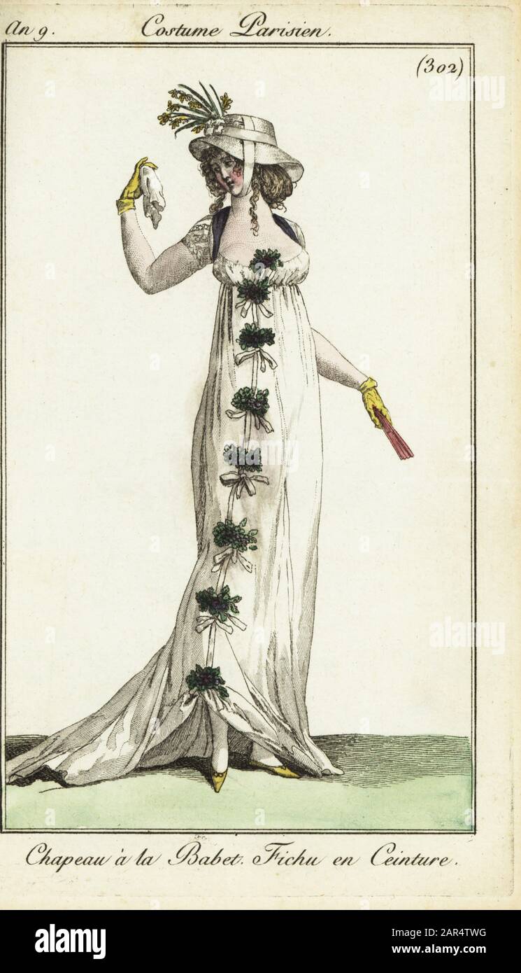 Fashionable woman or Merveilleuse in a low-cut dress, 1801. She has a Babet straw hat, a low-cut dress tied with foliage, and a kerchief used as a belt under the bust. The Babet hat was taken from a character played by Mme Louise-Rosalie Dugazon in Blaise et Babet, Comedie Italienne. Chapeau a la Babet. Fichu en Ceinture.  Handcoloured copperplate engraving from Pierre de la Mesangere’s Journal des Modes et Dames, Paris, 1801. The illustrations in volume 4 were by Carle Vernet, Bosio, Dutailly and Philibert Louis Debucourt. Stock Photo