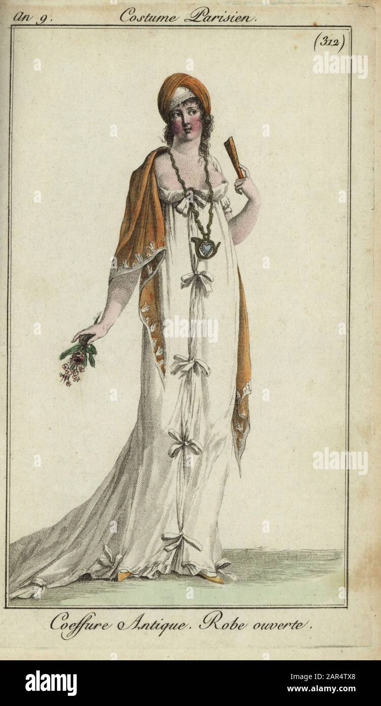 Fashionable woman or Merveilleuse in low-cut dress, 1801. She wears a classical hairdress, large necklace with heart, shawl, and bosom-revealing open dress tied with bows. She holds a fan and bouquet of flowers. Coeffure Antique. Robe ouverte. Handcoloured copperplate engraving from Pierre de la Mesangere’s Journal des Modes et Dames, Paris, 1801. The illustrations in volume 4 were by Carle Vernet, Bosio, Dutailly and Philibert Louis Debucourt. Stock Photo