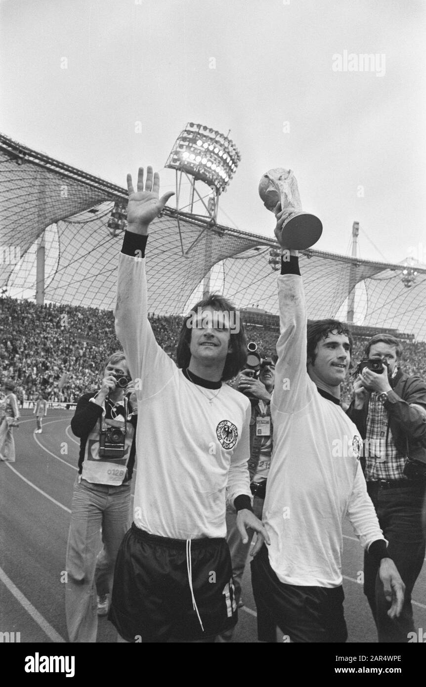 Final World Cup 1974 in Munich, West Germany against Netherlands 2-1; Gerd Muller with the World Cup, left Wolfgang Overath Date: 7 July 1974 Location: Munich, Netherlands, West- Germany Keywords: finals, sport, football, world championships Personal name: Gerd Muller Institution name: Netherlands Stock Photo