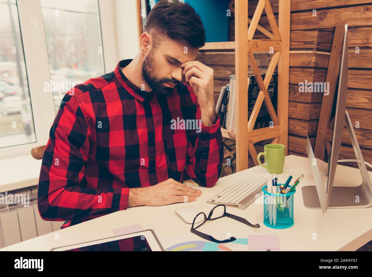 Portrait of tired minded man trying to finish hard task Stock Photo - Alamy