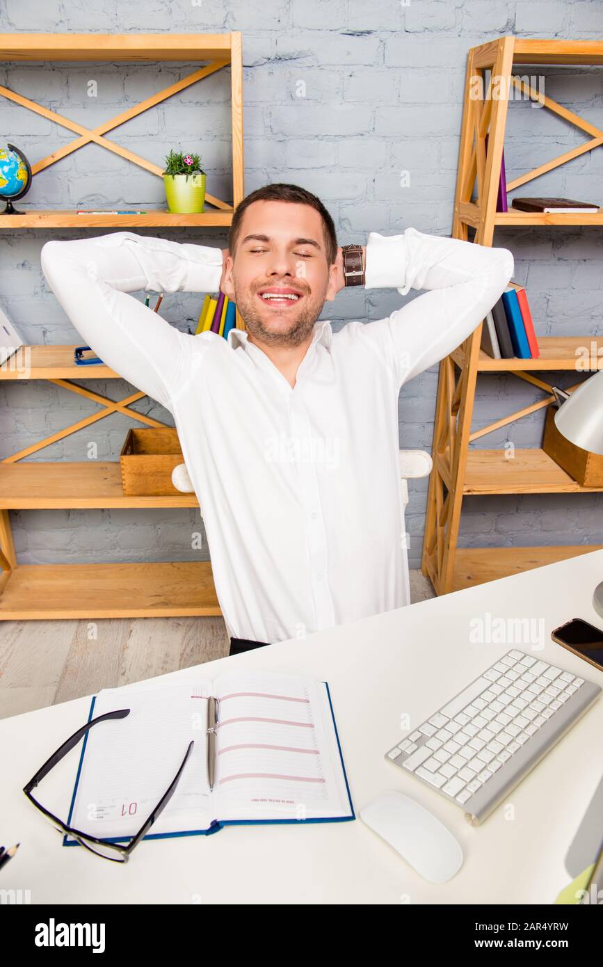 Happy man having rest after long working day Stock Photo - Alamy