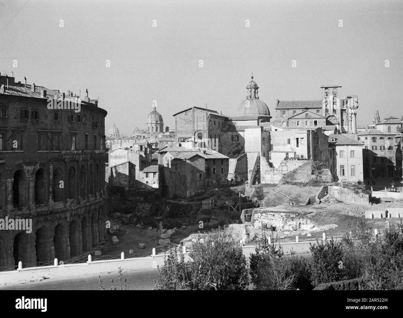 Rome: Visit to Vatican City  View of the Marsveld with left the theatre of Marcellus and in the background the dome of St. Peter's Basilica Date: December 1937 Location: Italy, Rome, Vatican City Keywords: archeology, buildings, church buildings, ruins, city sculptures, theatre Stock Photo
