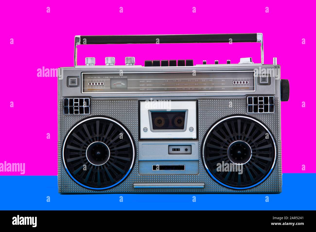 1980s Silver retro radio boom box on color background. Stock Photo