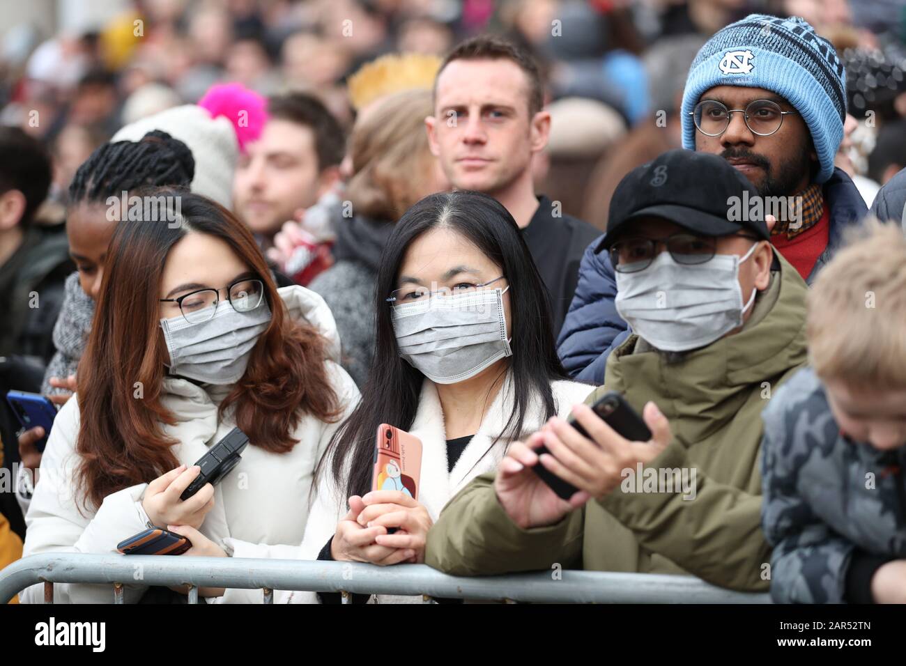 Spectators watch the parade during Chinese New Year celebrations in central London, which mark the start of the Year of the Rat. Stock Photo